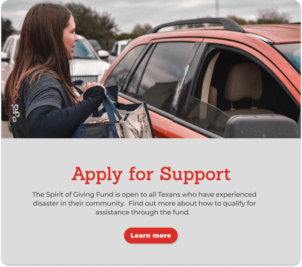 Volunteers passing out supplies to a family affected by a natural disaster