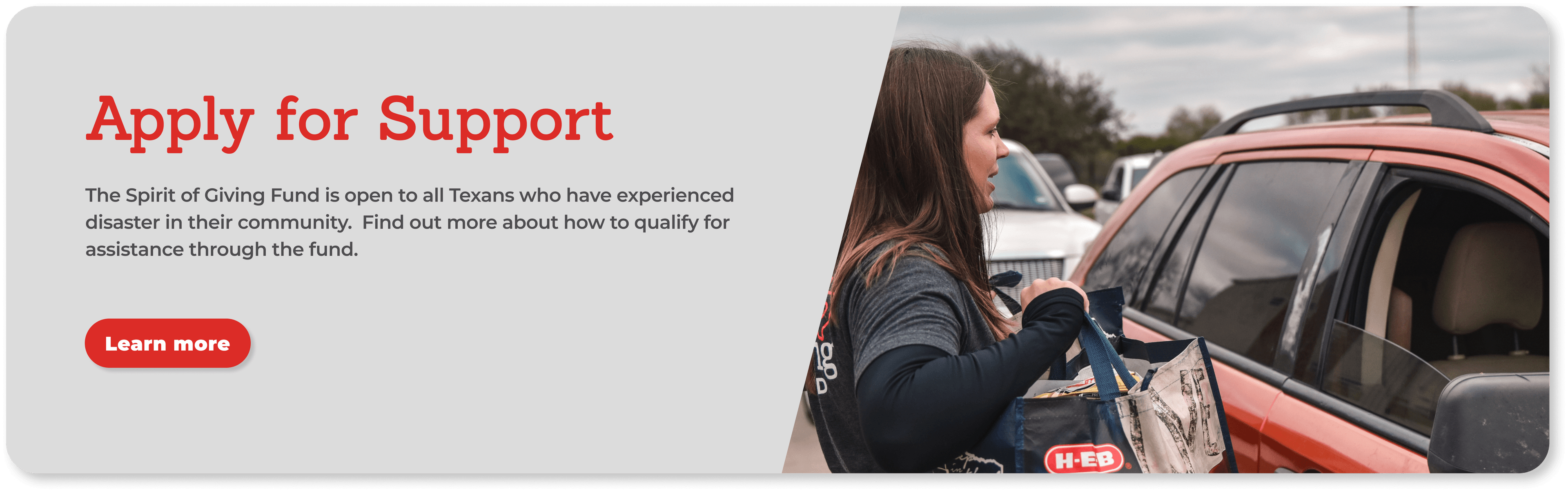 Volunteers passing out supplies to a family affected by a natural disaster